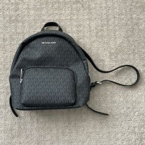 Black Michael Kors backpack.
